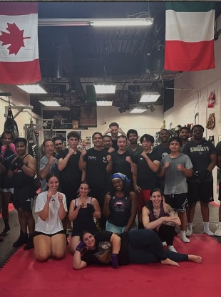 Patra Boxing members posing together after training in the gym.